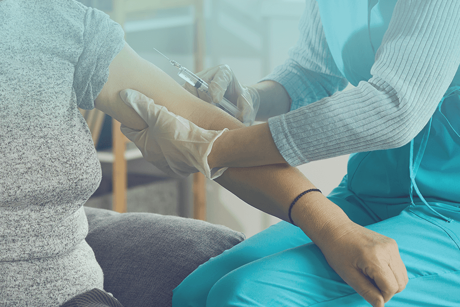 Person receiving allergy shots from a medical professional