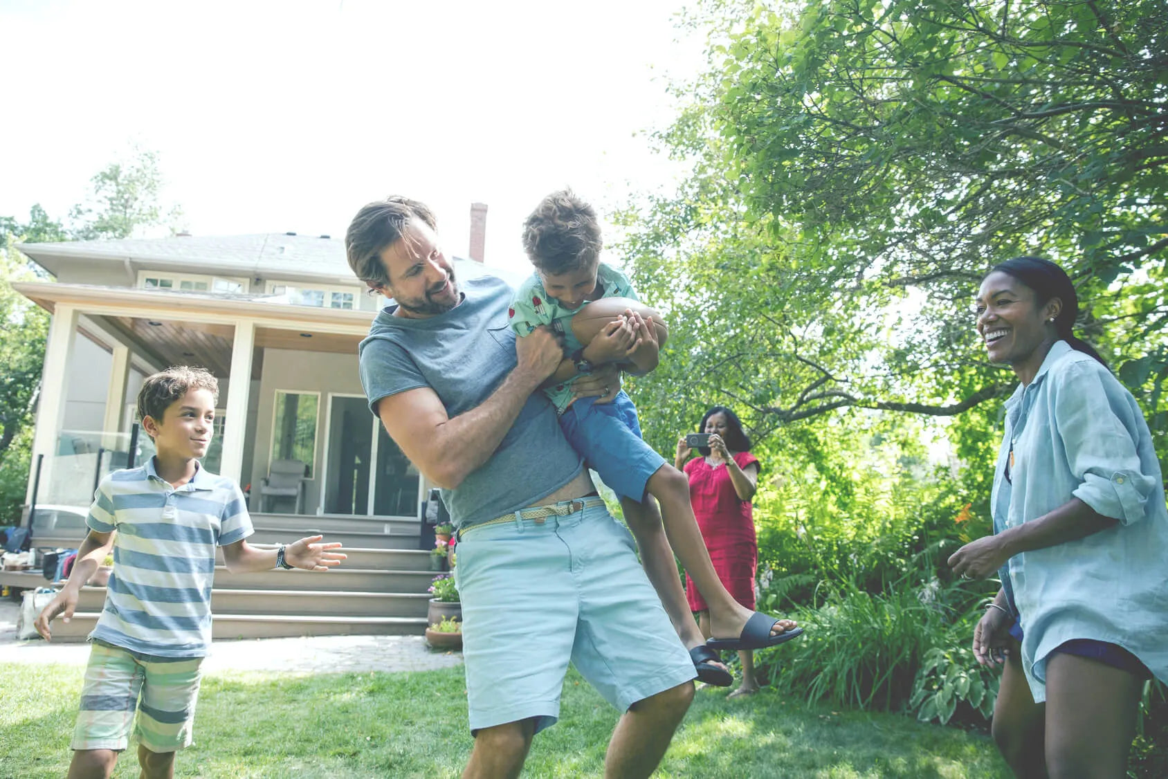 Dad and sons playing outside