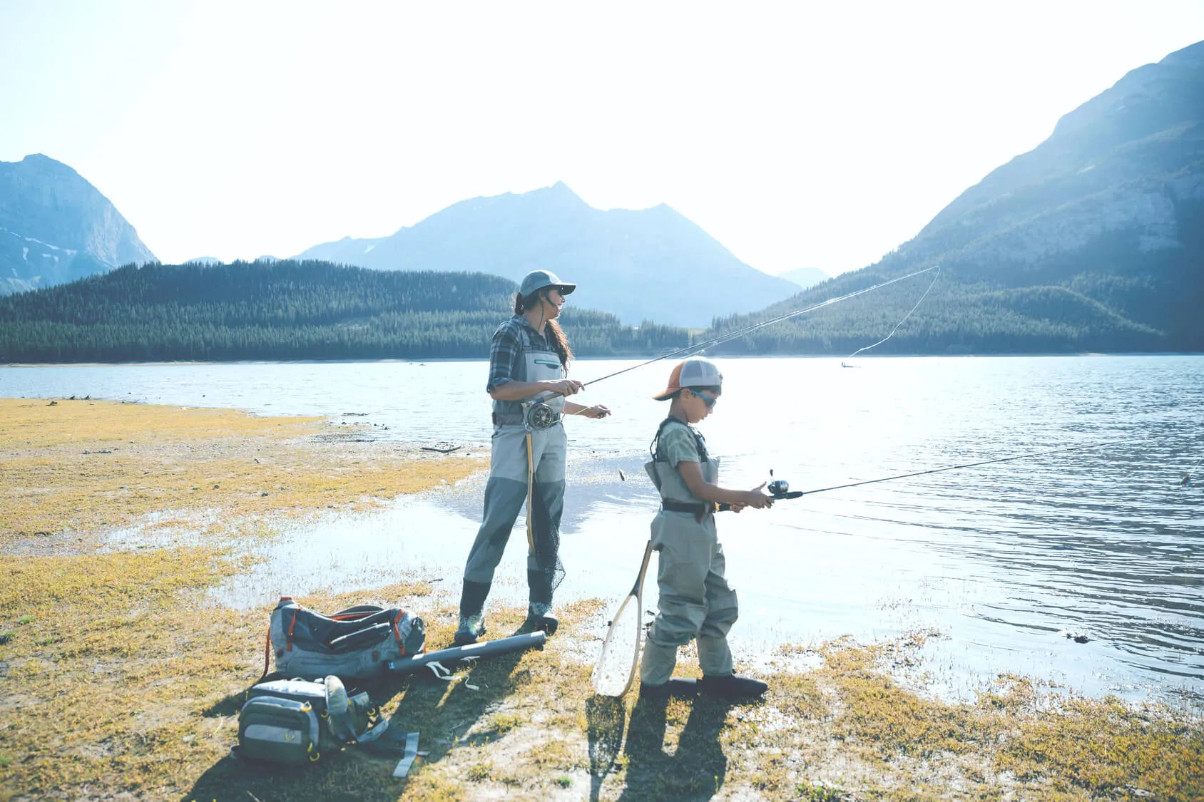 Father and son fishing in the mountains
